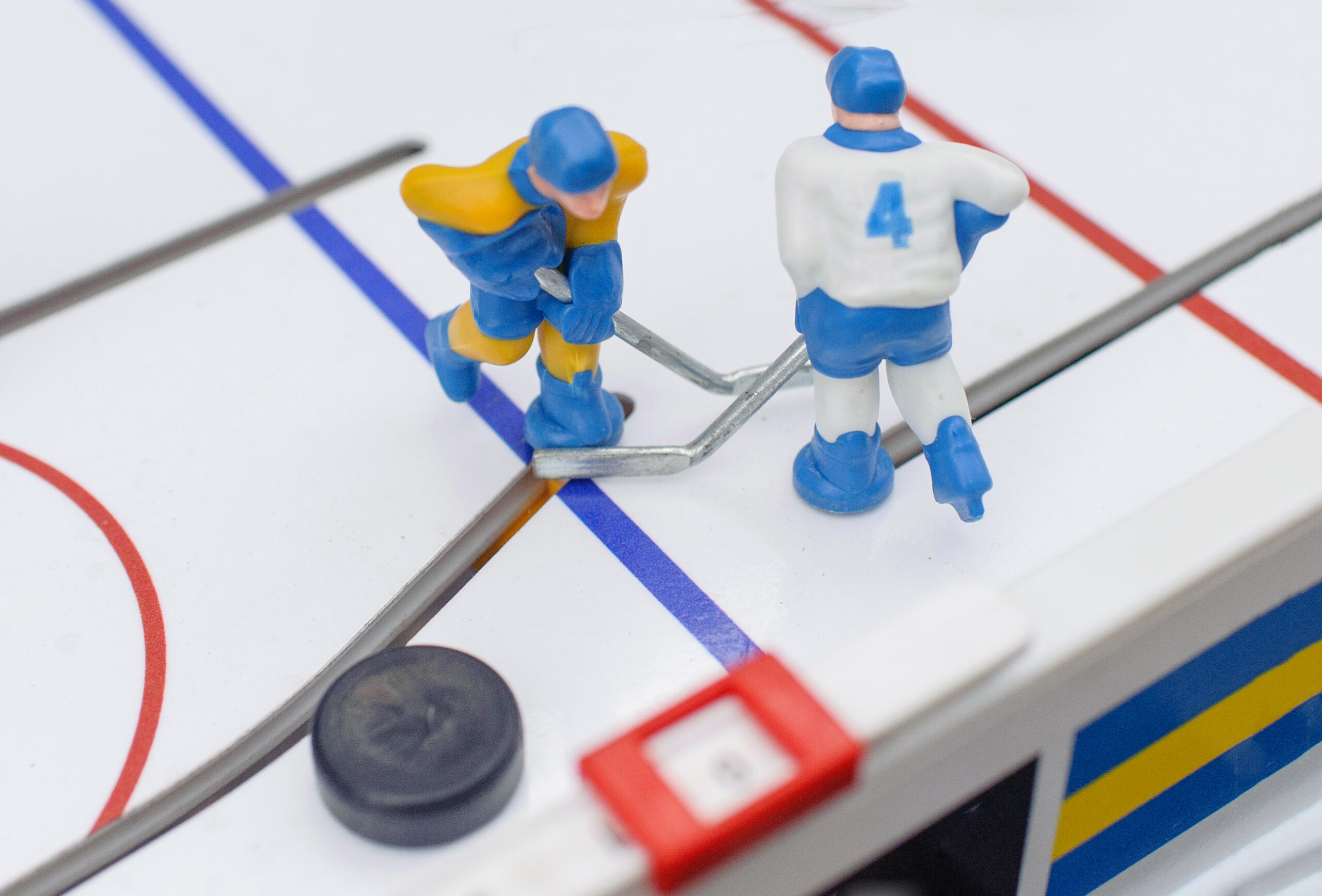 Close-up photo of a bubble hockey table.